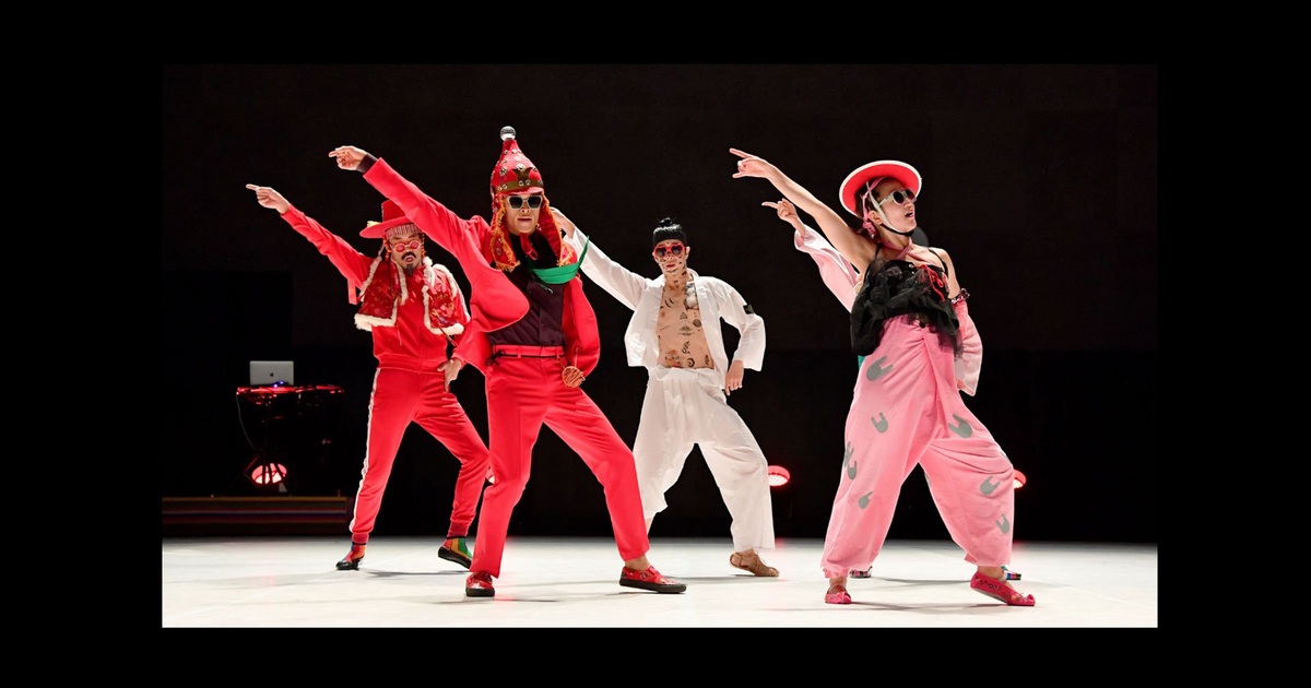 Ambiguous Dance Company performers in colourful costumes