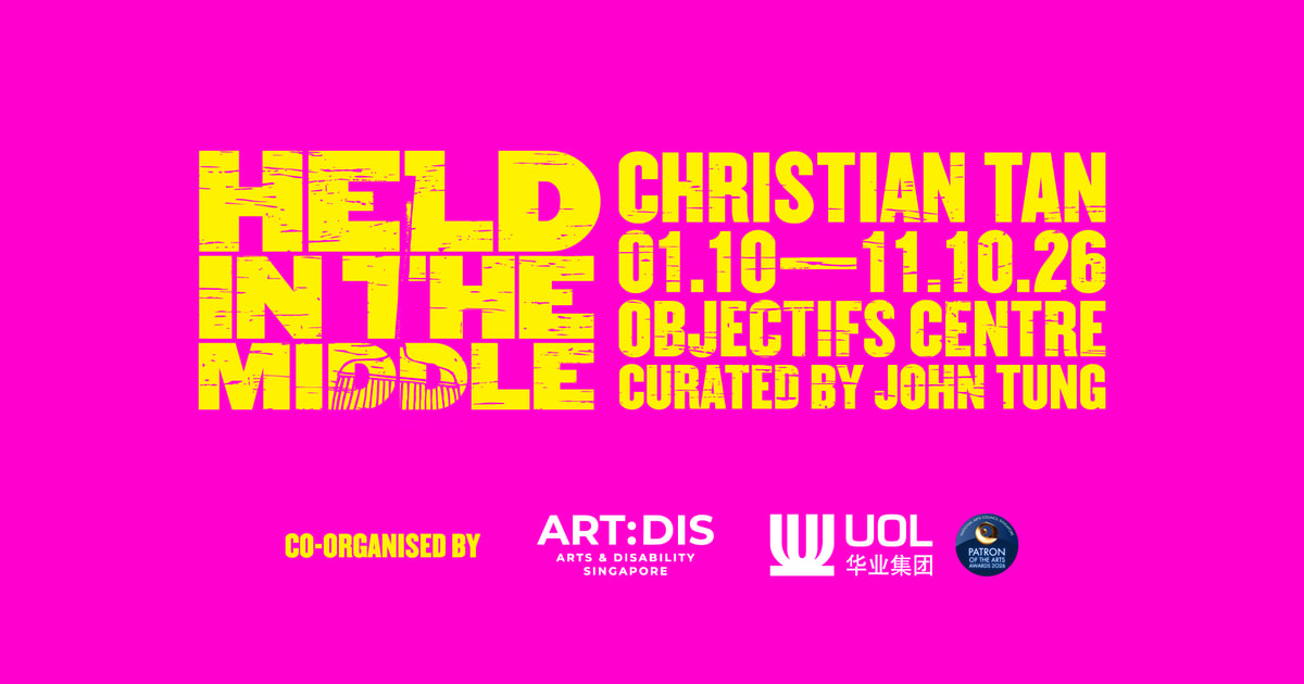 Pink and yellow Held in the Middle exhibition banner naming Christian Tan and Objectifs